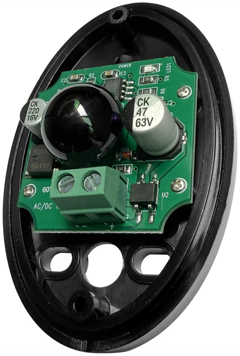 Close-up view of a photoelectric detector component for infrared beam sensor for automatic sliding garage doors with IR alarm.