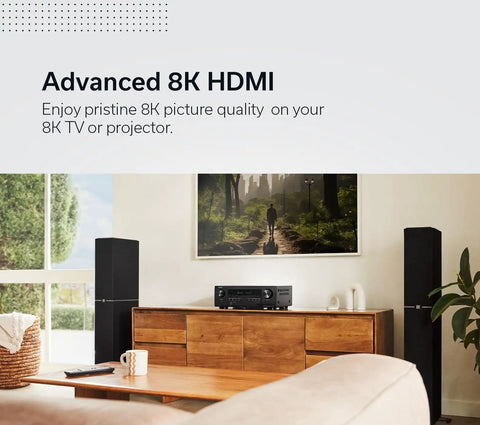 Living room setup with 7.2 Channel 8K HDR Home Theater Receiver With 75W Per Channel, Built In HEOS Wireless Streaming on cabinet.