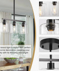 Sleek Black Three Light Kitchen Island Pendant Lamps Using Dimmable E26 Base hanging above a dining table with clear glass shades, bright ambiance.