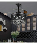 Total Game Changer 42 Inch Black Crystal Ceiling Fan With Adjustable Led Light And Wireless Remote 3 Speed hanging in modern dining room