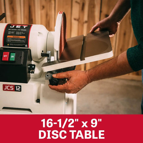 Heavy Duty 6 By 48 Inch Belt And 12 Inch Disc Sander With Closed Stand One Point Five Horsepower Dual Voltage showing 16-1/2" x 9" disc table in use.