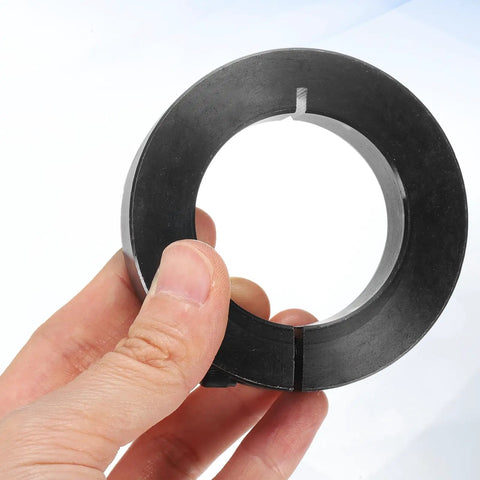 Hand holding two piece single split shaft collar with 45mm bore, 73mm outer diameter, 19mm thick, black oxide 1045 steel