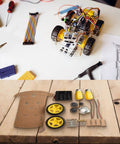 Arduino Compatible 2WD Smart Robot Car Chassis Kit With Speed Encoder For DIY Projects And Competitions parts laid out