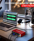 Red USB Audio Interface For PC And Mac, Pro Grade Studio Sound 24 Bit 192 KHz, Real Time Monitoring, connected to laptop
