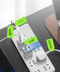 Pro Grade Ultimate Cable Management Kit 61 Piece Set With 30 Cable Labels organizing power cords on a power strip.