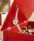 Red wooden box with a Six Pack Soft Close Lid Hinges With Hex Wrench Folding Lid Stay Hinge For Cabinets Wardrobes And Wooden Boxes Sturdy Zinc Alloy Construction Rust Resistant And Quiet Closure supporting the lid, showing colorful toys inside.