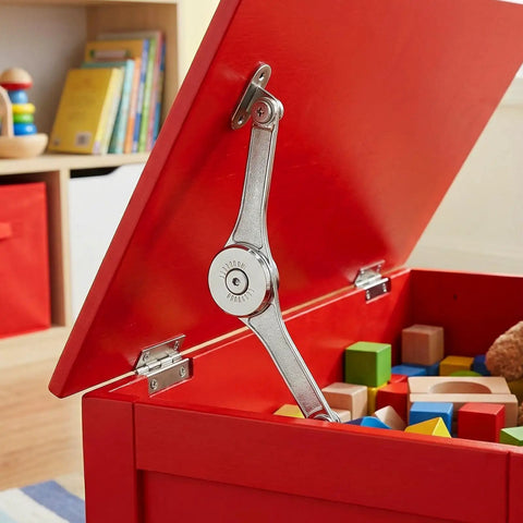 Red wooden box with a Six Pack Soft Close Lid Hinges With Hex Wrench Folding Lid Stay Hinge For Cabinets Wardrobes And Wooden Boxes Sturdy Zinc Alloy Construction Rust Resistant And Quiet Closure supporting the lid, showing colorful toys inside.