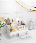 White Acrylic Makeup Organizer With Drawers For Vanity And Bathroom Counter Holds Your Glam Haul Secure Plus Multi Compartment Cosmetic Storage For Skincare And Daily Essentials, 6 cubbies with cosmetics and skincare.