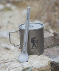 Ultralight Titanium Camping Spoon For Backpacking And Hiking, 16g Silver Utensil With 8.5 Inch Reach resting on outdoor stone