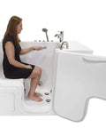 30X52 Transfer Walk In Bathtub With Microbubble Hydrotherapy Fast Fill Faucet And Right Dual Drain, showing a woman seated safely.