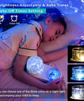 Child sleeping with 360 Degree Rotating Ocean Night Light Projector, jellyfish lamp, shows timer and color options.