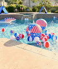 Colorful inflatable beach balls floating in a pool, part of a collection including the White 11 Inch Inflatable Beach Balls, 12 Pack for Pool Parties and Beach Games.