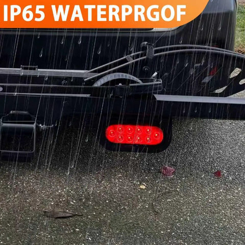 4 Pack 6 Inch Oval Tail Light Mounting Brackets, L Shaped, Powder Coated Steel 3mm, Flush Mount For Oval LED Trailer Lights On Boat Trailers, Boost Visibility And Safety, Tough As Nails Heavy Duty Mounts shown on trailer in rain