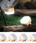 Four Pack Rechargeable Camping Lanterns With 300 Lumens, Three Light Modes, IP53 Waterproof shown lit in tent setting.
