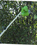 Green lawn mower with stainless steel scythe for grass cutting and edging replacement blades in a garden setting