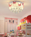 Pink Butterfly LED Crystal Chandelier Flush Mount Ceiling Light With Drum Shade in a colorful kids room setting.