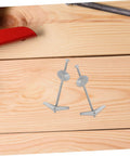 Heavy Duty Toggle Bolts And Wing Nuts Kit on wooden surface, carbon steel fasteners for drywall mounting and hanging heavy stuff.
