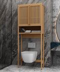 Stylish wooden bathroom cabinet with slatted doors, towels organized underneath, designed for modern bathroom spaces.