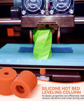 Silicone Bed Leveling Mounts For 3D Printer 12 Pack shown beneath heat bed while printing, demonstrating quiet shock absorption.