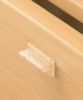 Close-up of a transparent silicone drawer pull from See Through No Drill Invisible Drawer Pulls Peel And Stick Hidden Cabinet Handles set
