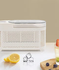 Great Slick And Totally Nifty Mini Countertop Ice Maker With 12V Car Adapter, compact design with ice cubes and fruits.