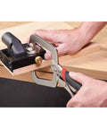 Rock Solid Pocket Hole Jig Face Clamp For Seamless Frame Joinery Featuring Adjustable Pressure and Lightning Fast Quick Release Lever for Dead Nuts Perfect Seams On Flat Woodwork Pieces in use on wood.