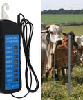 Ranch Ready Heavy Duty Electric Fence Voltage Tester showing neon readings and cows near a fenced pasture.