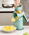 Rotary Cheese Grater Hand Crank 5 In 1 Mandoline Slicer shredding potato with strong suction base in kitchen