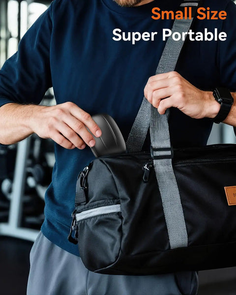 Person placing wireless earbuds with Bluetooth 5.4, 80 hour playtime, sport hooks, LED display into gym bag, Jet Black case.