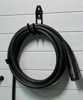Rugged EV Charging Cable Holder Wall Mount With Anti Slip Rubber Coating holding coiled cable against wall