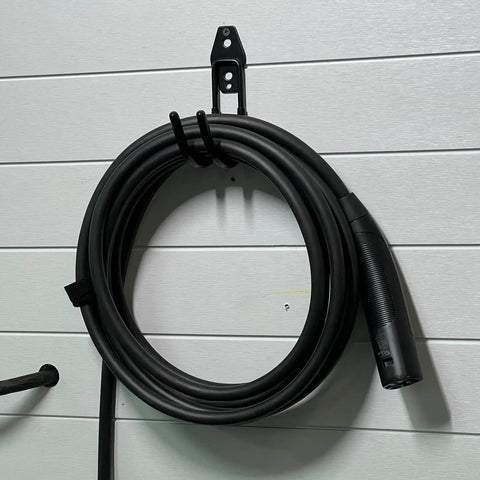 Rugged EV Charging Cable Holder Wall Mount With Anti Slip Rubber Coating holding coiled cable against wall