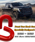Red Tow Hook Cover for 2020 to 2026 GMC Sierra 2500 3500 HD Tow Hitch Cover displayed in front of a black Sierra truck