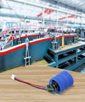 Super Turbo Fan 7.4V Brushless Motor Hits 80K RPM For Rapid Electronic Cooling Ultimate High Pressure Airflow For Custom PC, Automotive Systems, And Heavy Duty Industrial Gear with blue casing in workshop.