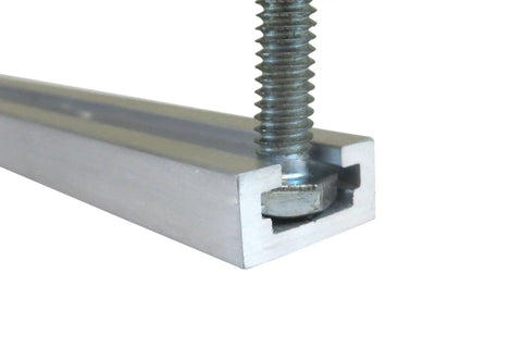 Close-up of a premium aluminum T slot track rail showing a quarter T bolt secured in a deep channel, 24 inches long.