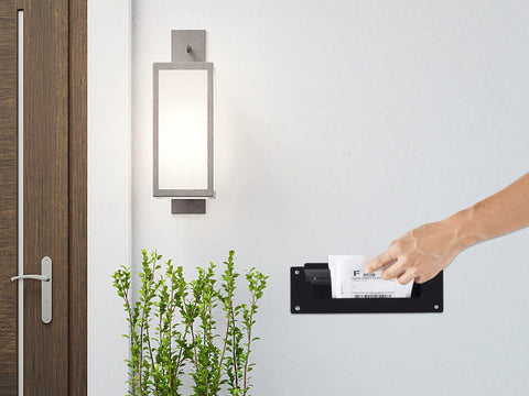 Person using Through The Wall Mail Drop Chute Adjustable Two Piece Steel Deposit Slot For Documents Letters Payments Keys And Other Non Bulky Mail For Home Office And Commercial Use Up To 1 Inch Thick Heavy Duty Black D100 in wall