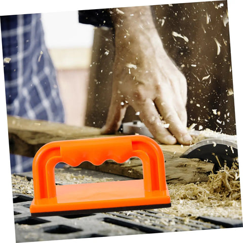 Safety Push Block for Table Saws and Router Tables Lightweight Portable Orange Woodworking Push Block for Workshops Safer Cuts and Precise Control All Day Performance in use guiding wood through a table saw.