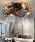 Twenty One Inch Low Profile Caged Ceiling Fan With Lights Remote Control Included Four Light Bulbs Dope Black Finish Flush Mount Fixture For Kitchen And Bedroom Industrial Style mounted on ceiling in living room.