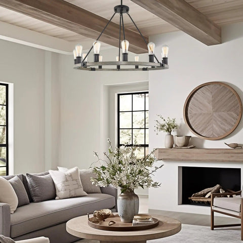 Homestead 25 Inch Six Light Wagon Wheel Chandelier With Gray Oak Wood Finish And Textured Black Accents in living room setting