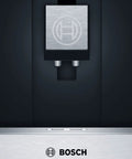 Close-up of the 24 Inch Wide Built In Automatic Coffee Machine With Home Connect, showing stainless steel finish and dispenser