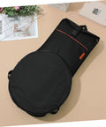 Road Ready Oxford Fabric Drum Storage Bag With Hella Tough Waterproof Seams For Packing Sticks Pedals And Percussion Gear On Long Haul Tours Or Weekend Campouts, black with orange accents.