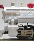 Close-up of Winter Wonderland LionChief Steam Locomotive Engine for O Gauge with detailed side view and metallic finish.