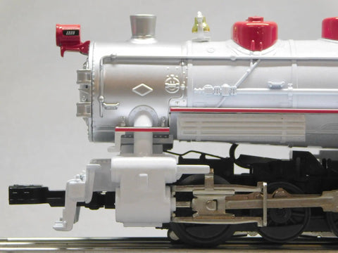 Close-up of Winter Wonderland LionChief Steam Locomotive Engine for O Gauge with detailed side view and metallic finish.