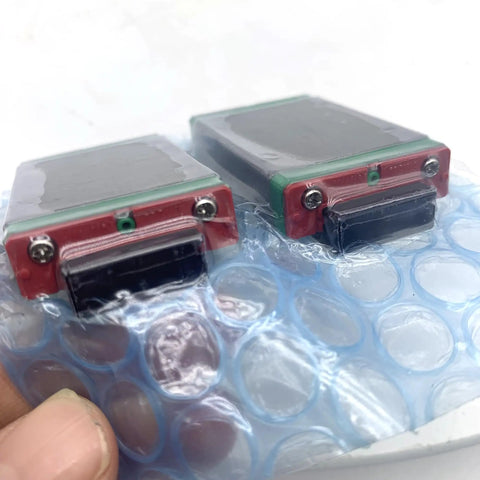 MGW9C Linear Guide Block for CNC Machines and 3D Printers Heavy Duty Rock Solid Carriage Rail Bearing with Gothic Arch Contact for High Rigidity and Smooth Motion in Automation Projects, two blocks wrapped in plastic