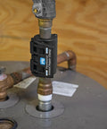 Instant Pipe Leak Repair Clamp Kit installed on a metal pipe for a watertight fix. Works under pressure for quick repairs.