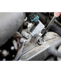 Person using a wrench from Mechanics Tool Set With One Quarter Inch And Three Eighths Inch Drives, 172-Piece on engine.