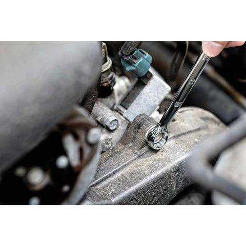 Person using a wrench from Mechanics Tool Set With One Quarter Inch And Three Eighths Inch Drives, 172-Piece on engine.