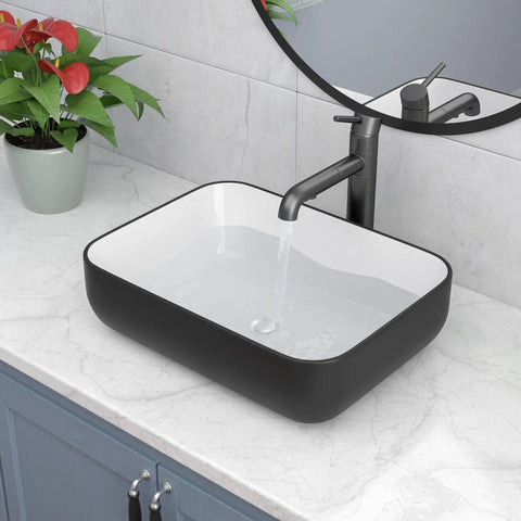 Rectangular Vessel Sink Dope Black And White Finish, 20 By 15 Inches, Above Counter Ceramic Porcelain Vanity Basin on marble countertop.