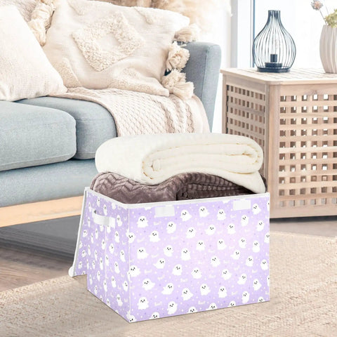Smooth Folding Storage Bin With Grippy Handles And Snug Velcro Cover Collapsible Oxford Fabric Tote For Closets And Dorm Rooms, filled with blankets.