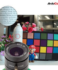 Day And Night Vision IMX477 HQ Camera For Jetson Orin NX with 6mm CS lens, color calibration chart and figurine backdrop