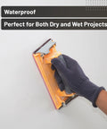 Gloved hand sanding with 18 Piece Wet Dry Sandpaper Kit 120 To 3000 Grit For Metal Wood Automotive And Furniture Includes Two Sheets Each Of 220 320 400 600 800 1000 And One Sheet Of 120 1200 1500 2000 2500 3000 Durable And Flexible For Hand Or Power Sanding